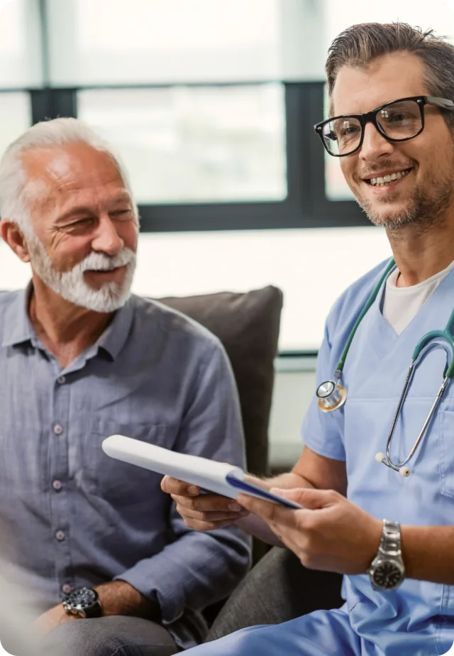 A clinician talking with an older patient