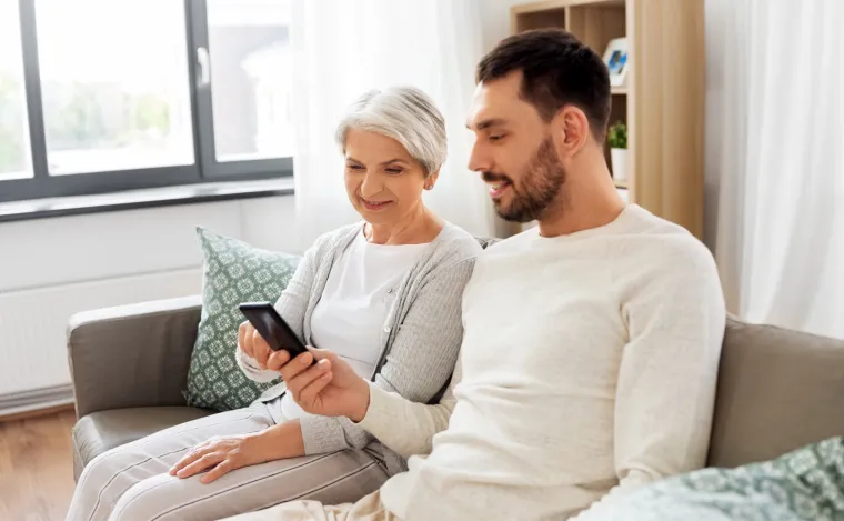 A caregiver and patient reviewing reminders together