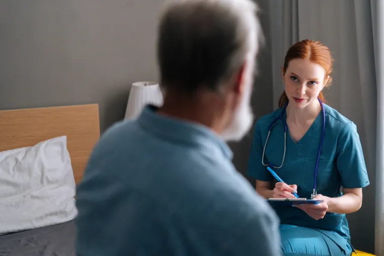 A patient talking with a clinician