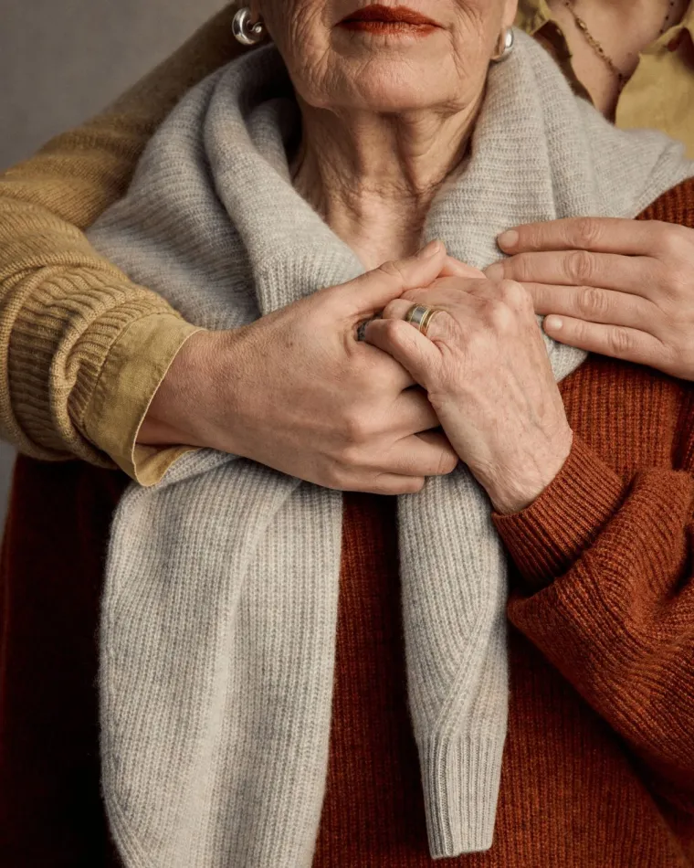 An older adult with a caregiver