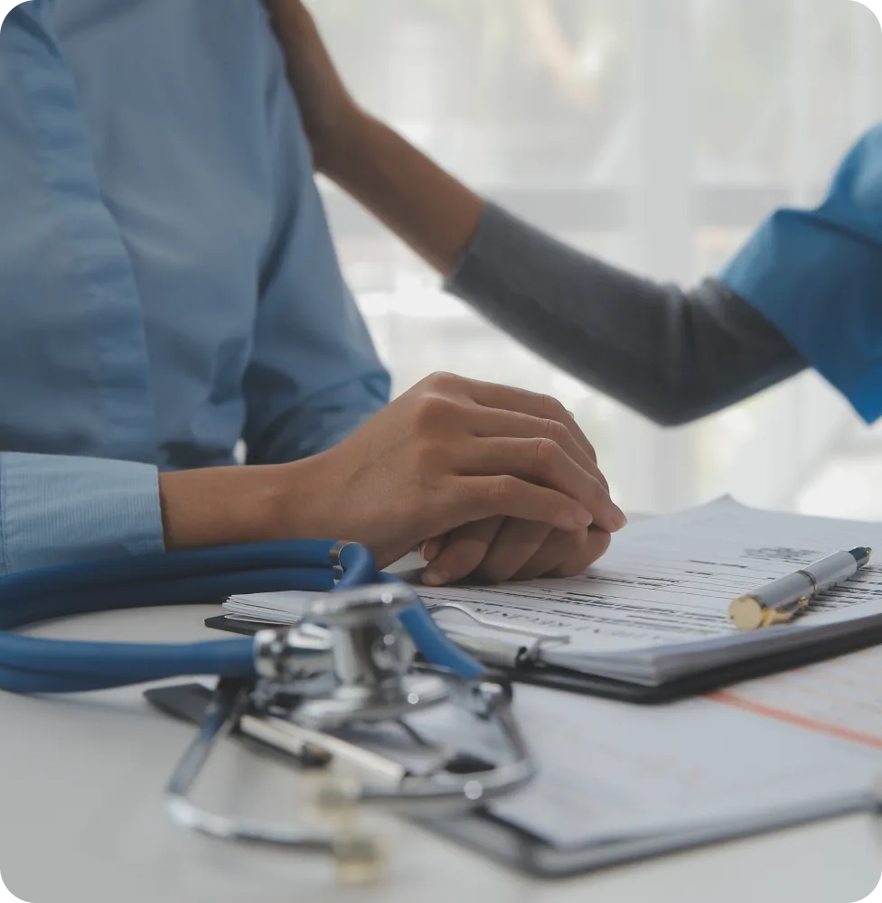 A clinician reviewing notes at a desk