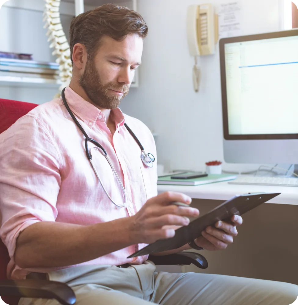 A clinician assigning a plan on a tablet