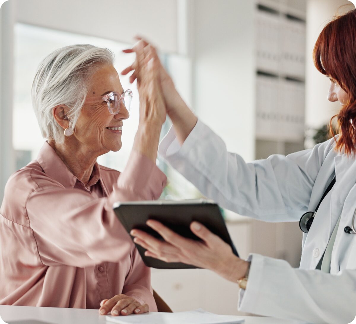 A clinician reviewing care with a patient