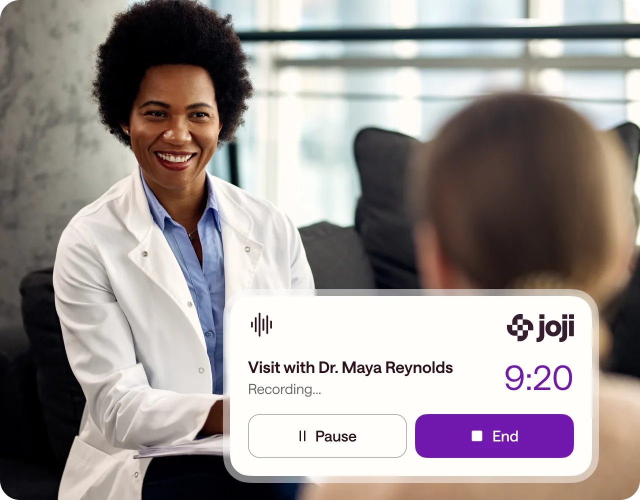 A doctor and patient with the Joji app recording their visit
